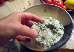 Slathering the eggplant into the herb mayonnaise wash 